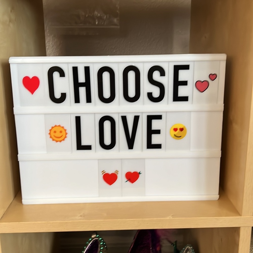 Light box sign with lots of letters and icons